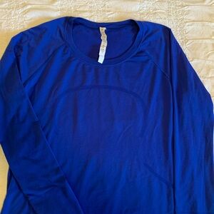Lululemon fast and free cobalt blue running shirt. Shorter length.